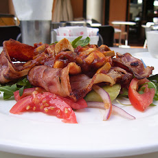 Warm Spinach salad with bacon and pine nuts
