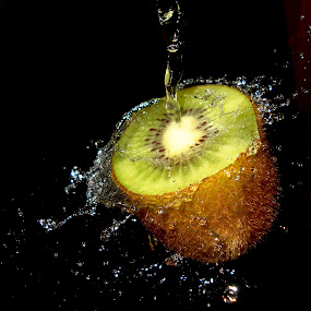 Kiwi Splashing by Premkumar Antony - Food & Drink Fruits & Vegetables ( water, stock, vitamins, diet, kiwi, food, fruits, health, cut kiwi, premkumar antony )