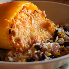 Stuffed Yellow Peppers With Spicy Swiss Chard and Scallion Pilaf