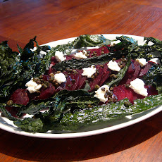 Beet salad with white cheese, fried capers and kale chips