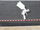 Paint Gun on a Wall