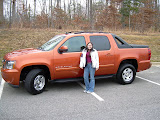 Katie standing next to the new truck, even though it is Chase's