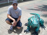 Chase next to another one of the iguana statues.