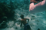 Johnny going down to coax the eel out of his home.