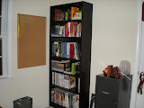 Bookcase full of books and magazines