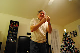 Dad pointing at his hand for something.