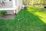 Down the side of the house.