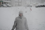 Katie tossin gsnow in the air like a little kid.