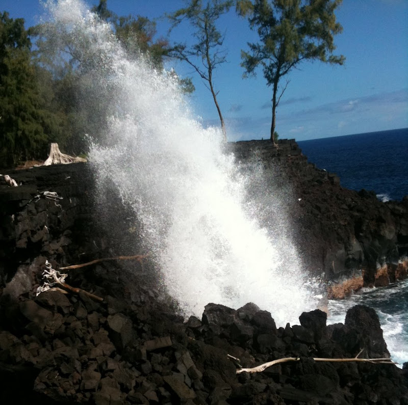 Wave crashing on lava coast