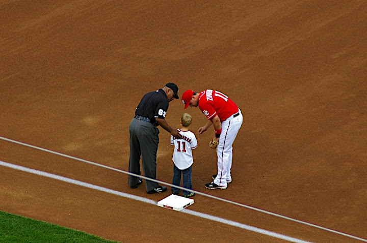 Zimmerman and Umpire talk to starting 9 kid