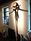 The piece on the wall is from the artist http://www.sculptorsam.com/.  Amazing fabrication skills.