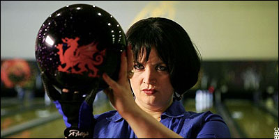 Nessa Bowled for Wales? - of course! Nessa holding a bowling ball decorated with a Welsh dragon