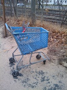 Another Marshalls cart near fence and tracks