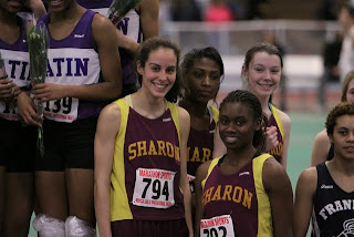 On the podium, the school record setting 4 x 200m relay team (from l to r): Ali Kirsch, Jen Jaboin, Camille Henry, & Sara Gildersleeve