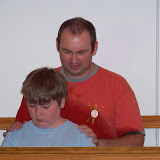 Pastor Mark praying over Anthony