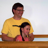 Pastore Tom, Joy's father, baptised Joy