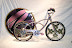 700c wheel shown in the background.  This bike is very small with 16