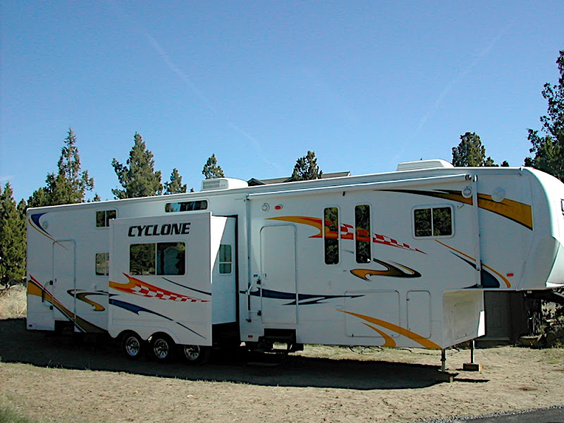  CALL 541-350-7005  like new perfect condition very comfortable plenty of storage, used for 3 short trips. The CYCLONE Features and Options  �	Cable TV/Satellite Hook-Up �	Custom Control Panel �	2nd A/C �	Auto Transfer Switch �	Neo-Angle Shower �	Hi-Rise Kitchen Faucet �	Deep Kitchen Sink �	Raised Panel Hardwood Cabinetry �	Residential full extension Drawer Guides �	Pantry �	Large Cabinet Storage/Countertops �	Queen Bed in Loft w/Cabinets �	Air Vent in Loft �	His/Hers Reading Lights in Loft �	Overhead Cabinets Throughout �	Single Level Master Suite �	110 Gallon Fresh Water Tank - Plus 12 Gal. Water Heater �	Hide-a-Bed Sofa �	Recessed Front Cap Storage �	Huge Front Wardrobe � Large Vanity Drawers �	Separate Commode Room �	Foot Flush Porcelain Commode �	Heat and A/C Vents in Commode �	Wide Body Design -101� �	Triple Axles w/Adjustable Shackles �	E-Z Lube Hubs � 12� I-Beam Steel Frame �	Power Front Jacks �	Large, Clean Pass-Through Storage �	Built-In Diamond Plate Tool Box �	Heated and Enclosed Underbelly �	Patio Light Under Awning �	Elect. Rear Stabilizer Jacks �	Easy Grip Steps �	Entry Assist Handle �	Radius Windows �	Radius Baggage Doors �	Rain Gutters w/Spouts �	Dual 30 lb. LP Tanks �	Static Line (w/Fuel Station) �	Hydraulic Slide-Outs �	One-Piece Walk-On Rubber Roof �	Welded Tubular Aluminum Construction �	Stunning Exterior Graphics �	Huge 94� Wide Door Opening �	1� Thick Plywood Garage Floor �	Ultra-Light Ramp Door (No Cables) � 12� Garage �	Overhead Storage in Garage �	Brushed Aluminum Work Center �    Fuel Station & Timer �	Large 8 Garage Door Ramp Options �	Central Vacuum System �	Electric Rear Jacks � Double Electric Queen Beds �	Rear Screen Enclosure �	10 Cu. Ft. Refrigerator �	5.5 KW Generator �	80 Amp Convertor �	Hi-Flow Water Pump �	Security Camera with Monitor in Bedroom �	Electric Rear Jacks �	Dual Beds in Garage �	Electric Front Landing Jacks �	Aluminum Wheels �	Detachable Ladder �	Microwave �	Refrigerator �	12 Gallon Water Heater �	TV Antenna w/ Booster �	TV Hook-Up in Bedroom and Loft �	15,000 BTU A/C �	Skylight �	Power Bath Vent �	2nd A/C �	Night Shades �	Bedroom Slide-Out �	Mini-Blinds in Garage � Saftey Package �	Water Heater Bypass �	Universal Docking Center �	Roll-Out Awning �	200W Pioneer Exterior Stereo �	Tinted Safety Glass Windows �	Patent Pending Improved Turning Radius �	Side Scare Lights �	Rear Flood Lights �	Spare Tire �	A/V METAL Package �	32� LCD Flat Screen TV �	12V Stereo �	Rockford/Fosgate 200W Amp Rockford/Fosgate Ceiling Speakers		