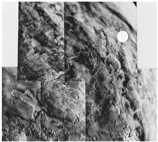  View from Viking 1 Orbiter showing two candidate landing sites. White circle indicates prime site in Chryse where Viking Lander 1 touched down a few days later. In this group of five adjoining photos taken from about 32,000 kilometers (20,000 miles) through a violet filter, Chryse is shown lying at the mouth of the channels, which proceed southward on the planet. An alternative site lies on a plateau adjacent one of the canyons in the lower (foreground) part of the picture. A bit of the planet's limb can be seen in the upper right-hand corner. Near the lower right-hand corner is a white cloud, believed to be ice crystals. From a comparison with pictures taken three minutes apart, the cloud was found to be moving about 97 kilometers (60 miles) per hour toward the upper left of view. Overall, the picture spans about 40° in longitude and 35° in latitude. The prominent feature in the lower left frame is Grangis Chasma, an arm of the great equatorial rift. North in these views is toward upper-right-hand corner.