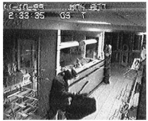 Images digitized from a surveillance system recording.