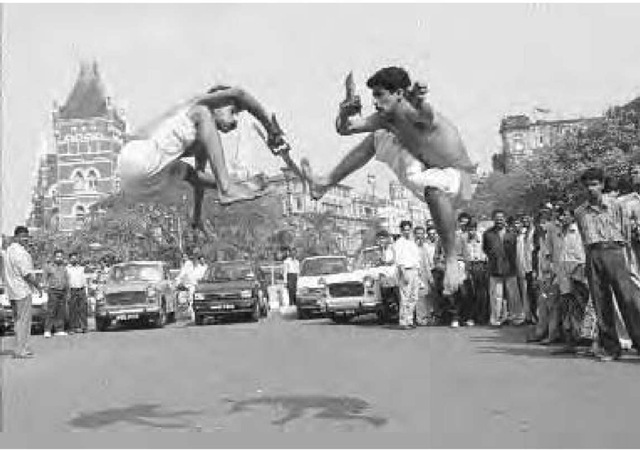 Satish Kumar (left) and Shri Ajit (right) perform a dagger fight in Bombay, December 27, 1997. The duo are in Bombay to promote Kalarippayattu, the ancient physical, cultural, and martial art of the state of Kerala in southern India.