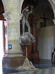 Part finished sculpture showing Michael slaying the dragon (evil) but then breaking his sword.