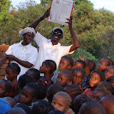  &ndash; James holds up the box from Nazareth House that contains the candy, he is with teacher, Lucy. …. © 2008 NHA Photos