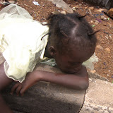  &ndash; child resting as she looks for water June 2007 (James Mansaray, photography)