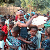  &ndash; Teacher at Nazareth House Kabala School distributing candy canes sent from Nazareth House in USA. (picture taken by James Mansaray)