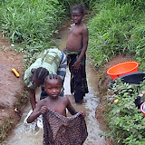  &ndash; Young children washing clothes in Kabala stream. 2006. (picture taken by James Mansaray)