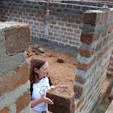  &ndash; handing bricks to workman -- Sept 2007.......© 2007 NHA photos
