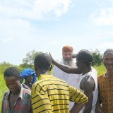  &ndash; explaining to Fr. Seraphim the needs of the village.......© 2007 NHA photos