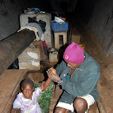  &ndash; Mohamed helps his daughter into the home.......© 2007 NHA photos