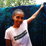  &ndash; Kadijah smiles as she points out the material in its transformation colors...Nazareth House Media Photos, July 2008
