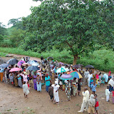  &ndash; The rain pours down on the parents as they wait distribution of their child's uniform....© 2008 Nazareth House Media, JBM photographer