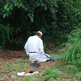  &ndash; Fr. Seraphim praying behind the man's wood.....© 2008 NHA photos