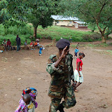  &ndash; SL Army personel bringing child to NHA Kabala School..© 2008 September Nazareth House Apostolate Media, James B. Mansaray, photographer.
