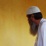  &ndash; Fr. Seraphim paints NHA Logo/Trade Mark on the Kabala School Building...© 2008 September Nazareth House Apostolate Media, James B. Mansaray, photographer.