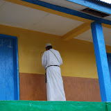  &ndash; Fr. Seraphim paints NHA Logo/Trade Mark on the Kabala School Building...© 2008 September Nazareth House Apostolate Media, James B. Mansaray, photographer.