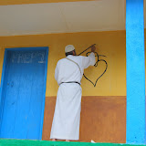  &ndash; Fr. Seraphim paints NHA Logo/Trade Mark on the Kabala School Building...© 2008 September Nazareth House Apostolate Media, James B. Mansaray, photographer.