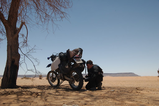 Inflating the tire under an Acacia tree.