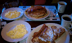 Tracey just got the largest stack of pancakes I have ever seen