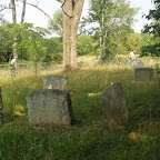 Owen and George weed eat around tombstones before mowing. Gleaves-Clements July 2010