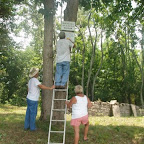 Owen and Betty look on as George mounts the sign warning vandals.
We will proscute!