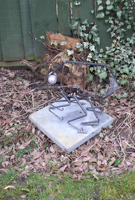 Giant metal flea in the garden