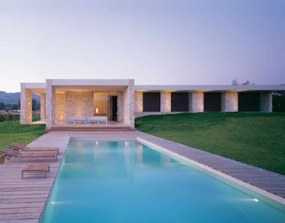 contemporary stone home with swimming pool