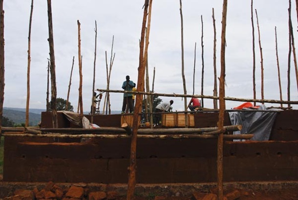 The First use for the trees is as scafolding for the construction of the walls.