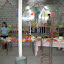Ladies preparing a birthday celebration for the pastor - the sanctuary converts into a fellowship hall.
