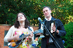 andrew and polly played a pretty song while people put flowers in the bucket
