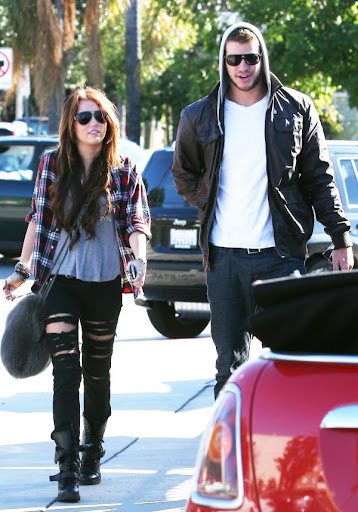 miley-sexy-ripped-black-jeans (25).jpg
